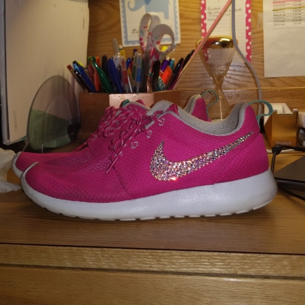 Pink bedazzled Nike Roshes